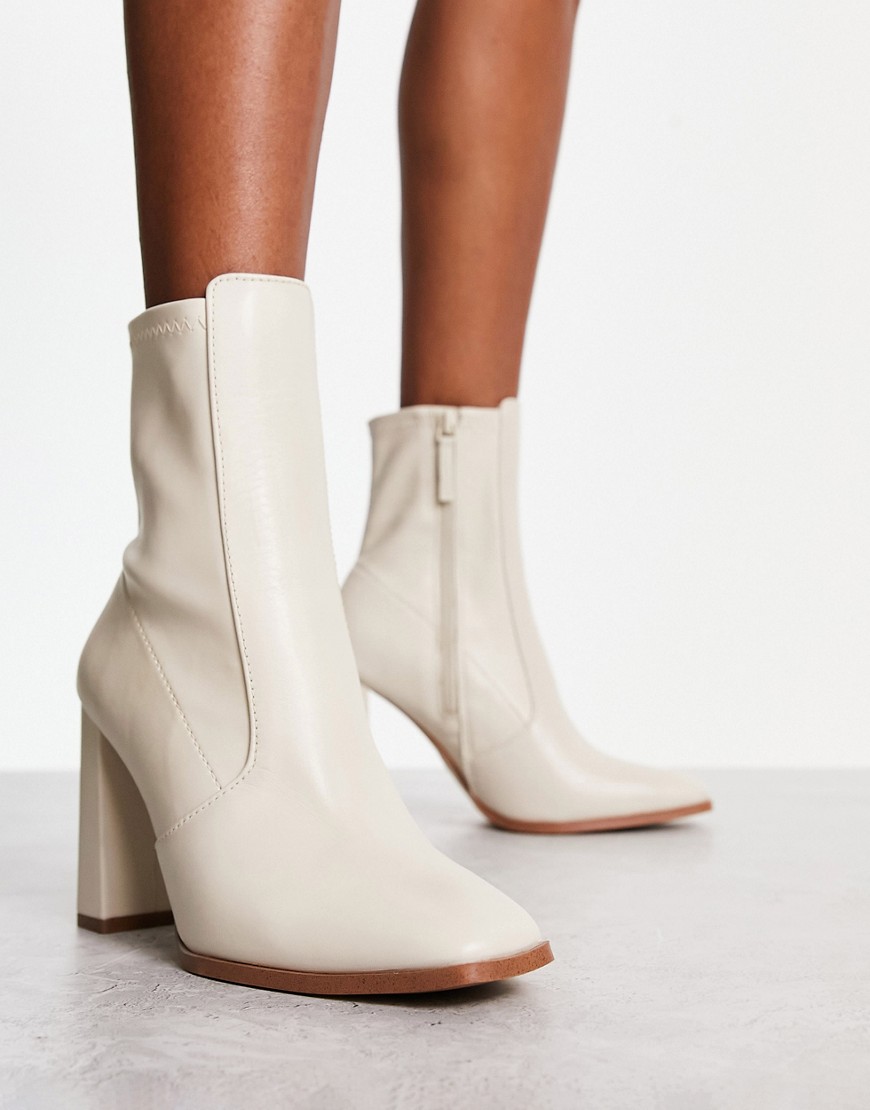aldo audrella heeled ankle boots in ecru-white