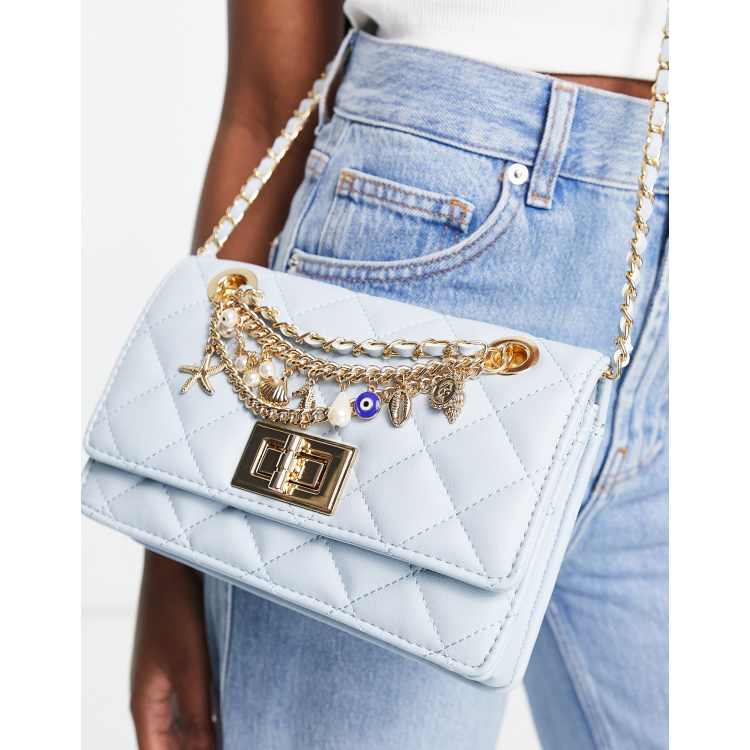 ALDO Erudia cross body bag with eye charm chain in powder blue | ASOS