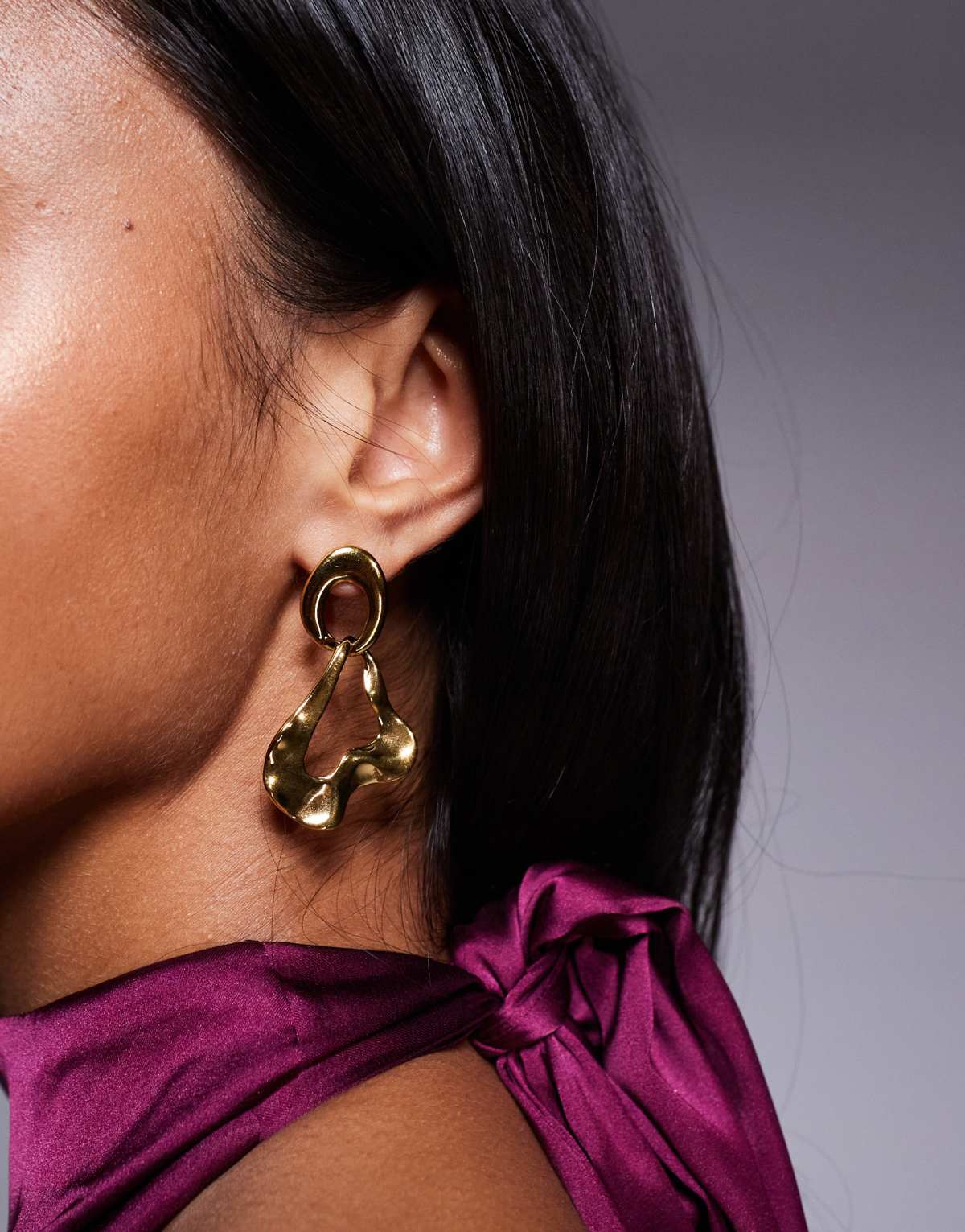 ALDO glowup molten stainless steel water resistant stud earrings in gold