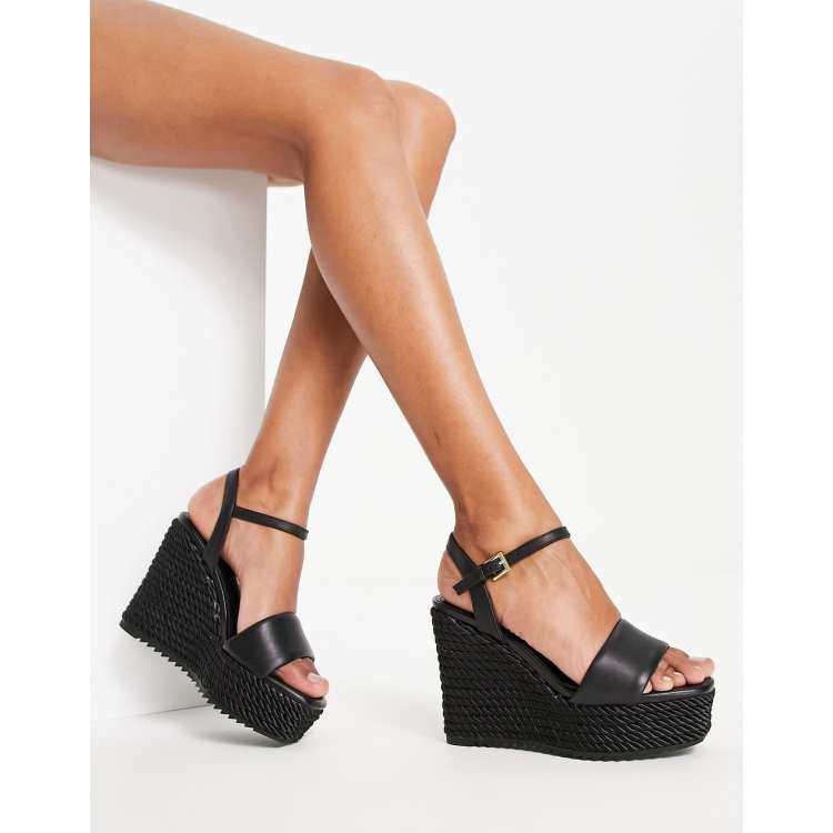 Black high clearance wedge sandals