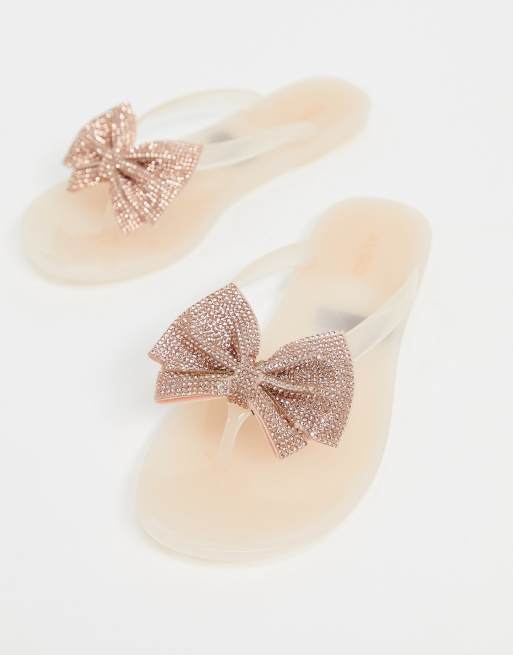 Gold bow hot sale flip flops