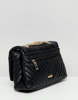 black quilted purse with gold chain strap