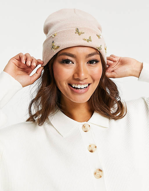 ALDO Riraldan knitted beanie hat with gold butterfly detail in blush