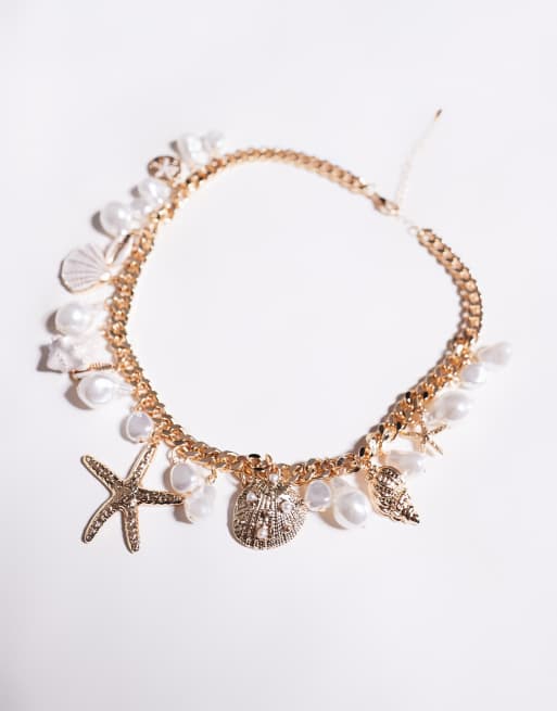 ALDO rivierra shell and starfish chunky charm necklace in gold, 2 of 3