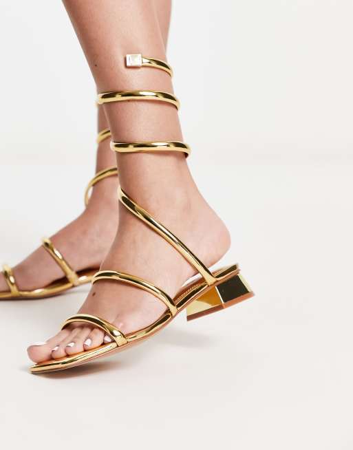 Aldo - Spinna - Sandalen met wikkelontwerp in spiegelende goudkleur 