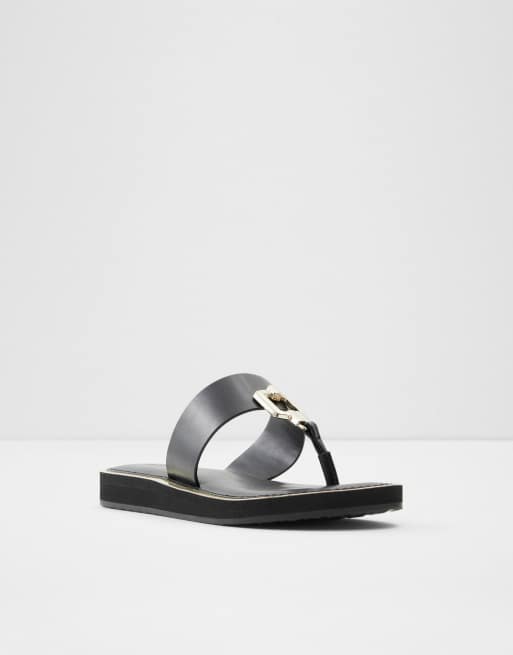 ALDO – Tatyx – Flache Sandalen mit Zehensteg und Metalldetail in Schwarz , 2 von 4