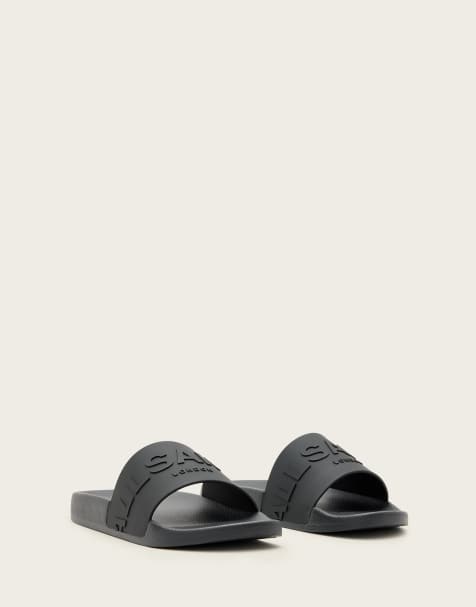 AllSaints – Biggy – Svarta tofflor i gummi med ton-i-ton-färgad logga - view 1