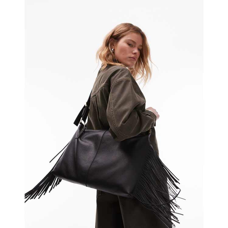 AllSaints Edbury suede fringe shoulder bag in black | ASOS