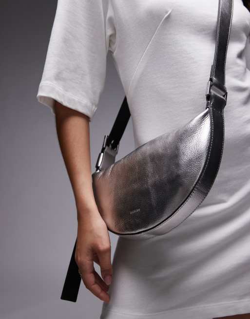 Allsaints half moon cross body bag in silver | ASOS