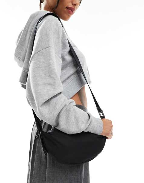 AllSaints Half Moon nylon crossbody bag in black - view 1