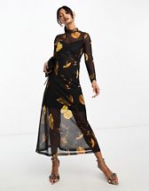 Vero Moda Curve wrap front knitted mini dress in black | ASOS