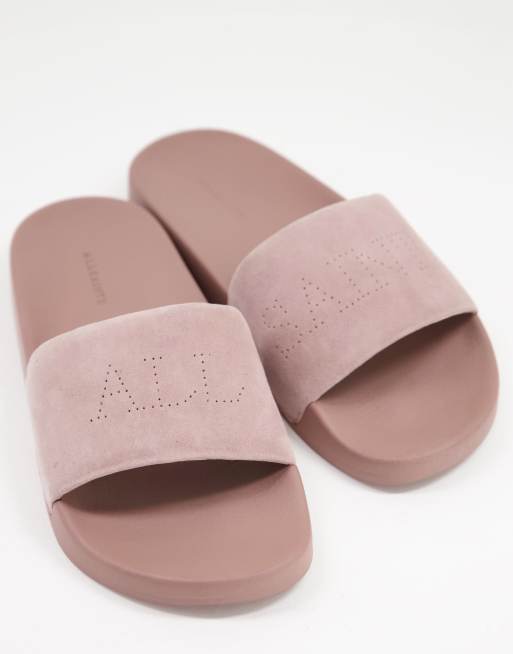 AllSaints Karli suede pool sliders with logo in blush pink ASOS