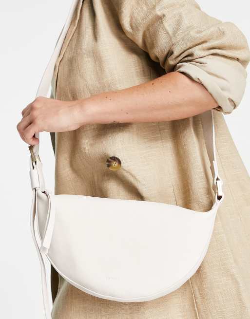 AllSaints leather half moon cross body bag in white