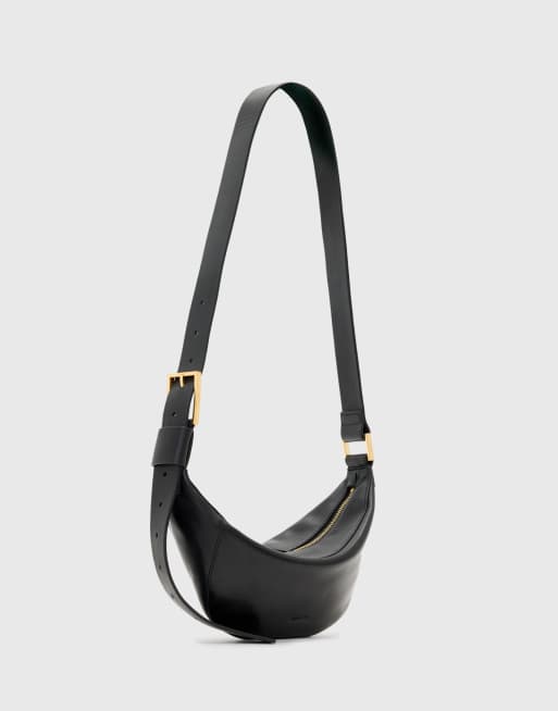AllSaints - Luna - Borsa a mezzaluna a tracolla nera in pelle d'agnello 