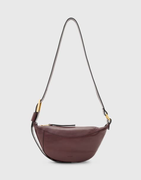 AllSaints Luna half moon leather crossbody bag in burgundy - view 1