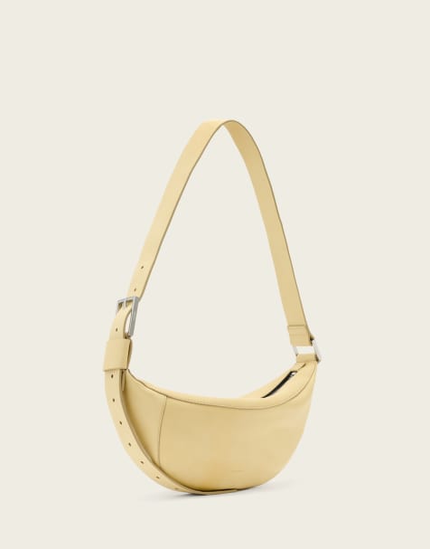 AllSaints Luna lambs leather crossbody bag in pale yellow - view 1