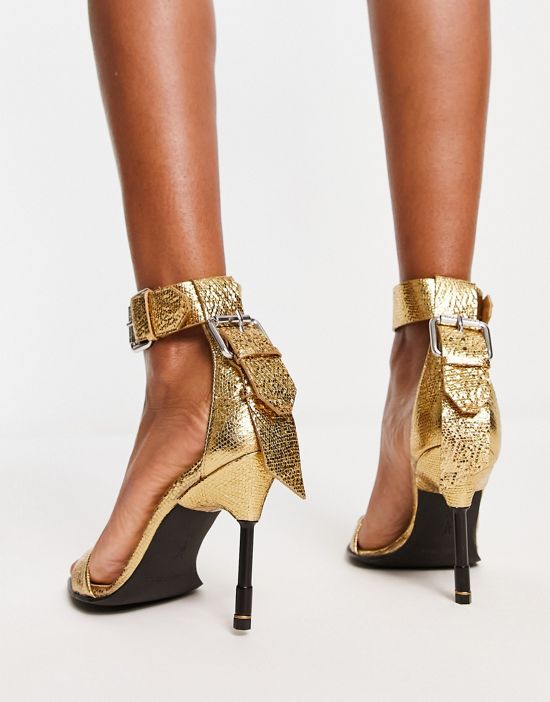 https://images.asos-media.com/products/allsaints-noir-metallic-leather-heeled-sandals-in-gold/203270778-2?$n_550w$&wid=550&fit=constrain