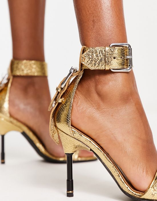 https://images.asos-media.com/products/allsaints-noir-metallic-leather-heeled-sandals-in-gold/203270778-3?$n_550w$&wid=550&fit=constrain