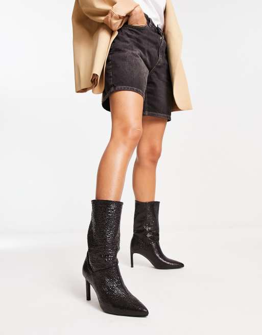 AllSaints Orlana leather shimmer pull on heeled boots in black | ASOS