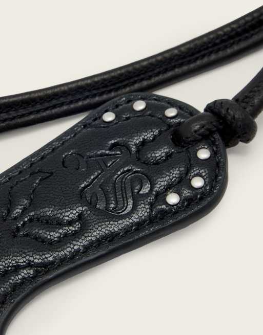 AllSaints - Portachiavi stile cowboy western in pelle nero e dorato, 3 di 3