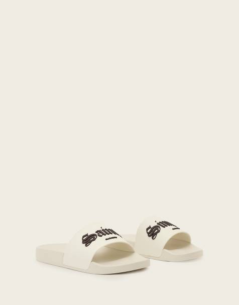 AllSaints – Saints & Sinners – Slider in Weiß mit einem Riemen und Logo - view 1