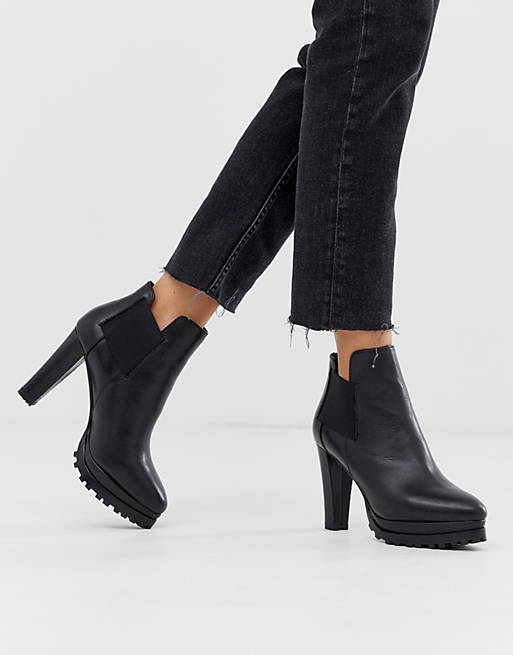 AllSaints Sarris heeled leather boots in black | ASOS