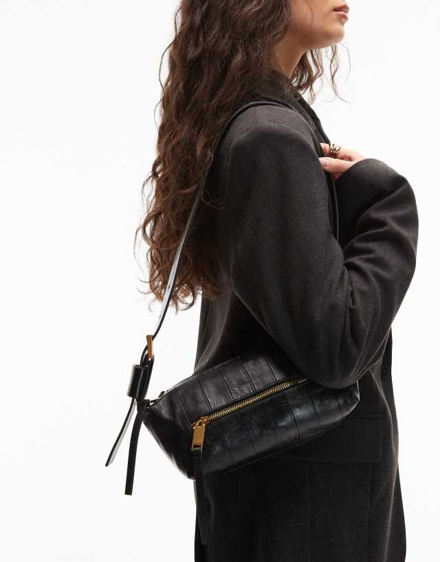AllSaints Vega panel small shoulder bag in black | ASOS