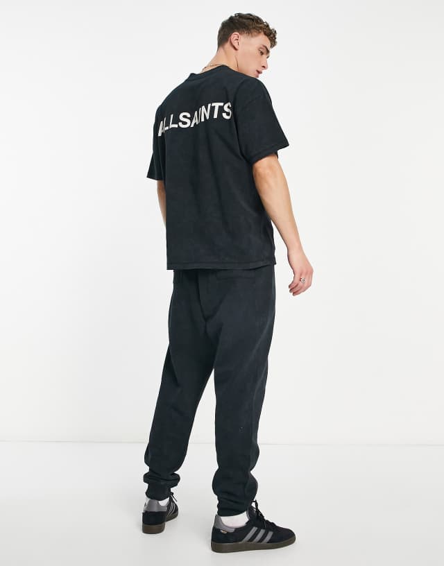 Allsaints x ASOS exclusive sweatpants in acid wash black