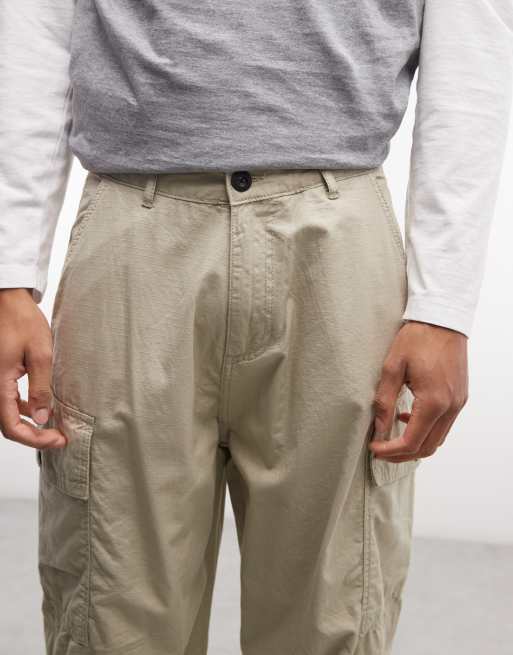 Alpha Industries cargo trousers with adjustable leg toggles in light beige, 4 of 5