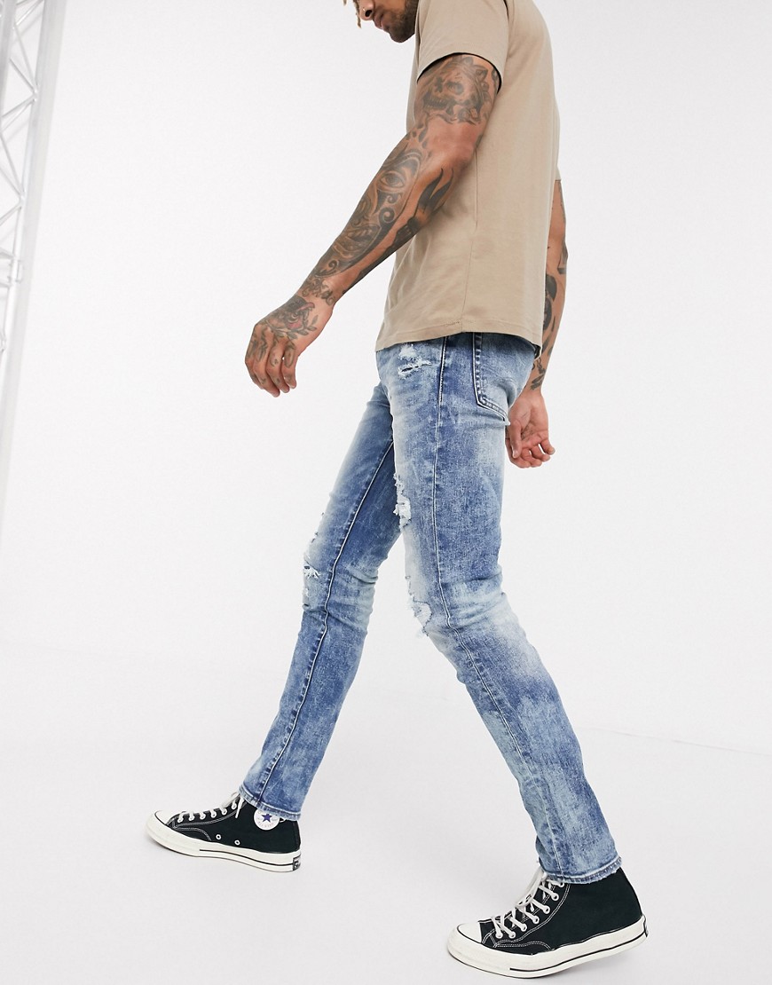 American Eagle – Blå skinny jeans med slitna detaljer och använd look