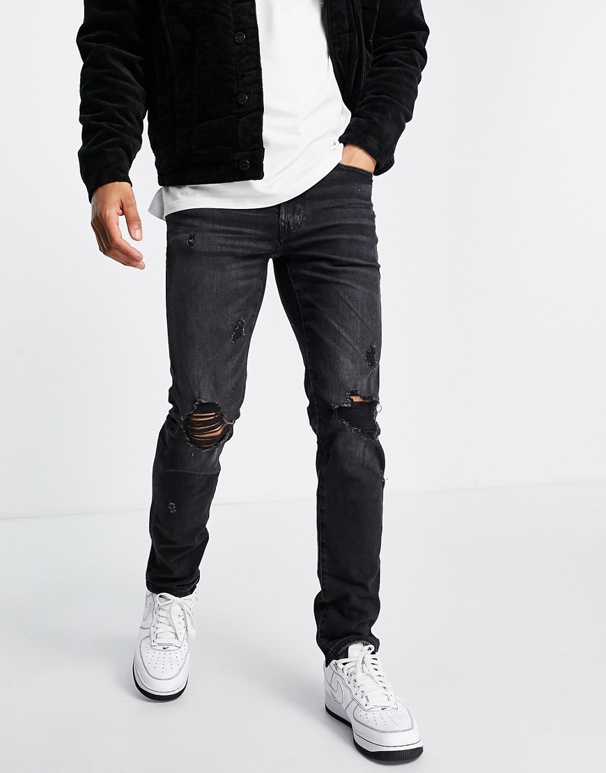 American Eagle - Slim-fit distressed jeans met wassing in zwart