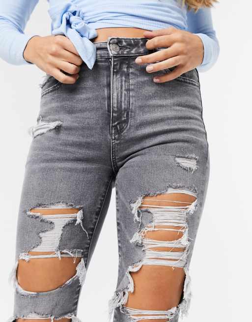 American eagle jeans with store holes in front and back