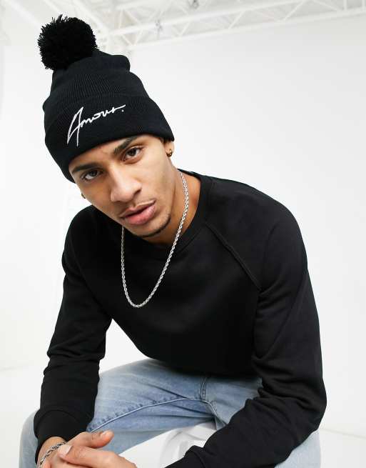 Amour branded pom-pom hat