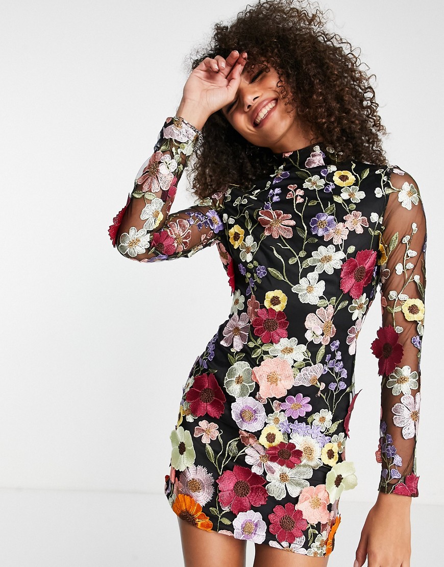 Amy Lynn backless mini dress in black based floral embroidery