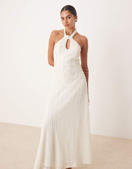 Amy Lynn embellished knit halter maxi dress with drop hem in cream | ASOS