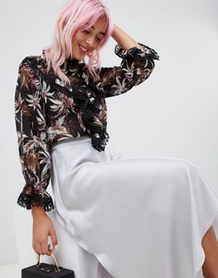 Amy Lynn Hoogsluitende blouse met bloemenprint-Zwart