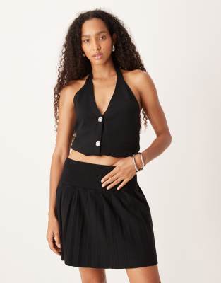 Amy Lynn - Mini-jupe plissée en maille - Noir