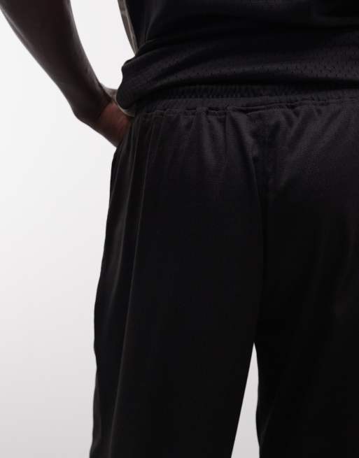 AND1 Airtex – Svarta basketshorts med kontrasterande kamouflagedetaljer och logga, 5 av 5
