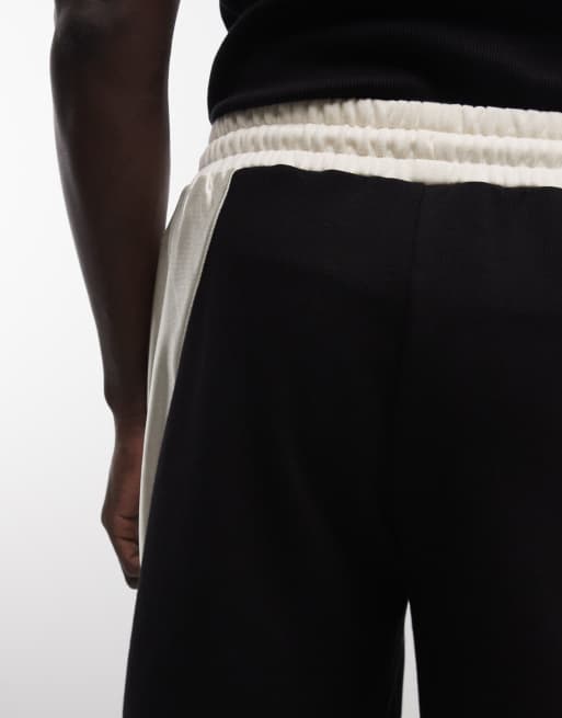 AND1 basketball shorts with contrast panels in black, 4 of 5