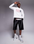 [AND1] AND1 oversized longline sports shorts with motif print in black S BLACK