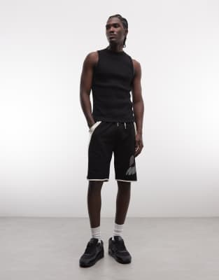 AND1 - Short de basket à empiècements contrastants - Noir