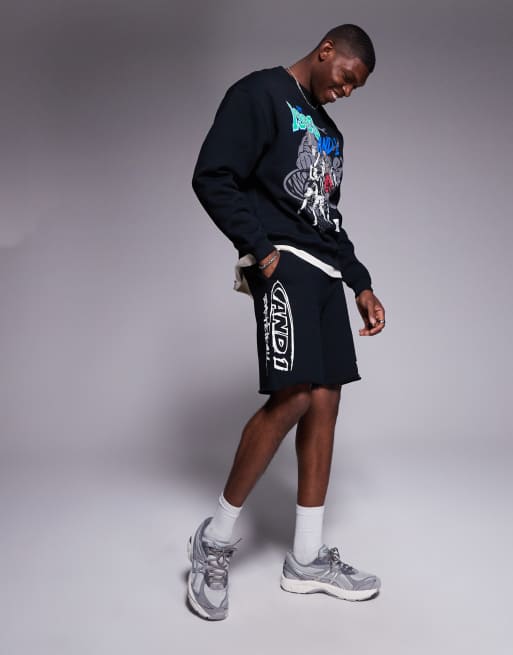 AND1 – Svarta shorts i oversize med sportigt tryck och råskuren fåll, 3 av 5