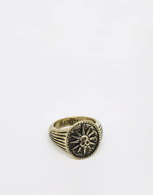 Anillo dorado tipo sello con diseño de calavera Burning Man de Classics 77
