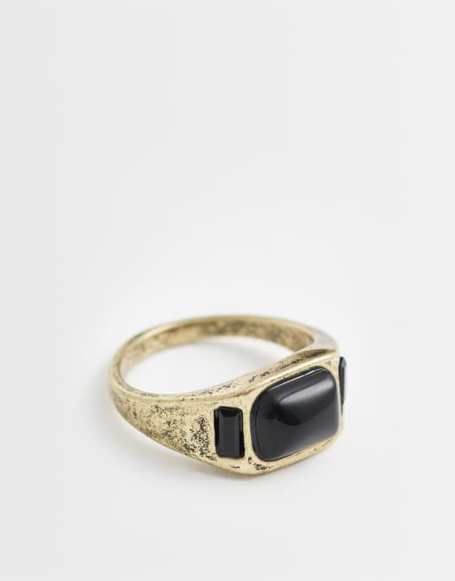 Anillo dorado tipo sello con tres piedras negras de ASOS DESIGN