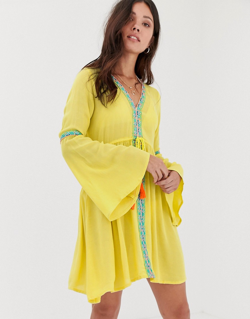 Anmol Midi Length Yellow Plunge Neck Beach Dress With Embroidered Panels and Tassel Tie