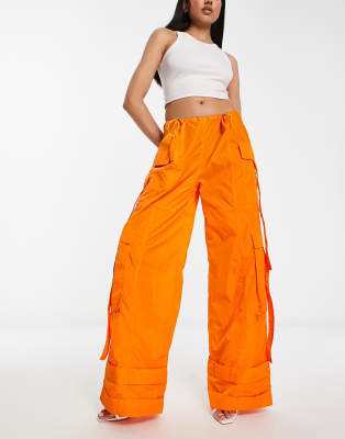 Annorlunda nylon oversized parachute pants in bright orange