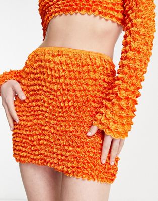 popcorn textured super mini skirt in bright orange - part of a set