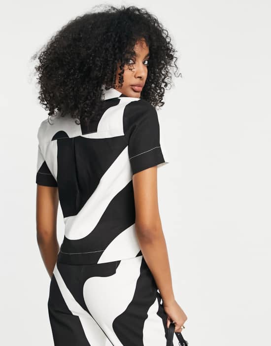 https://images.asos-media.com/products/annorlunda-retro-print-shirt-in-monochrome-part-of-a-set/202079706-2?$n_550w$&wid=550&fit=constrain