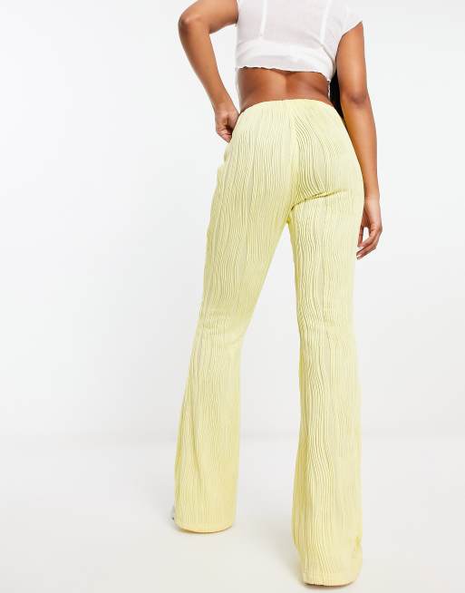 Annorlunda wavey texture flares in sunshine yellow ASOS