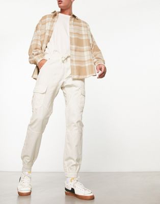 Another Influence cuffed cargo trousers in off white